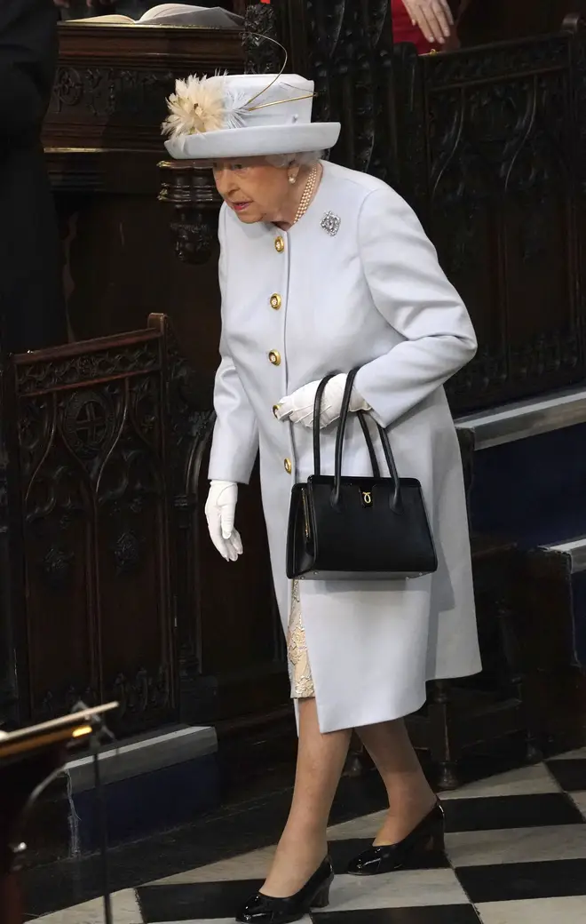 The Queen always favours a black handbag