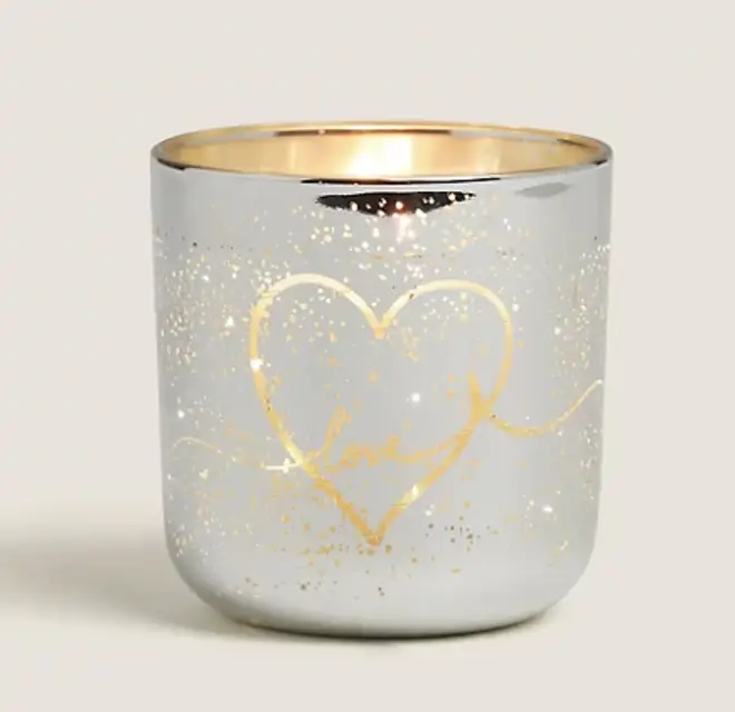 This candle votive lights up when it's lit, creating a beautiful effect