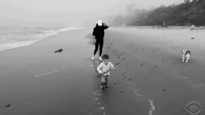 Archie is seen running along the beach in the adorable clip