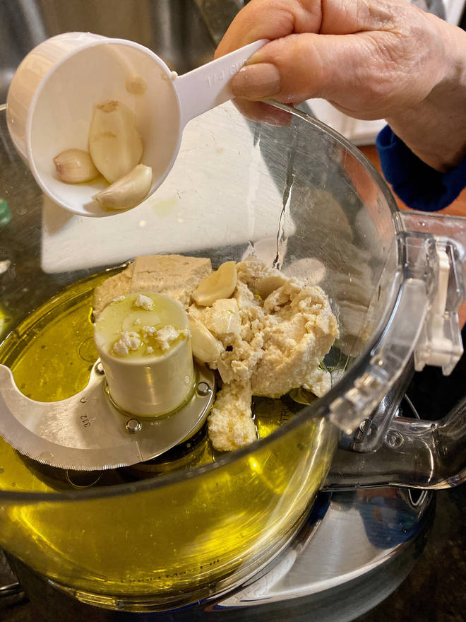 The mum reveals she bulk buys garlic and preps it in advance in the food processor (stock image)