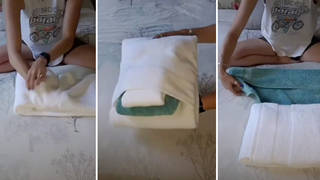 The woman unveils beautifully-folded towels