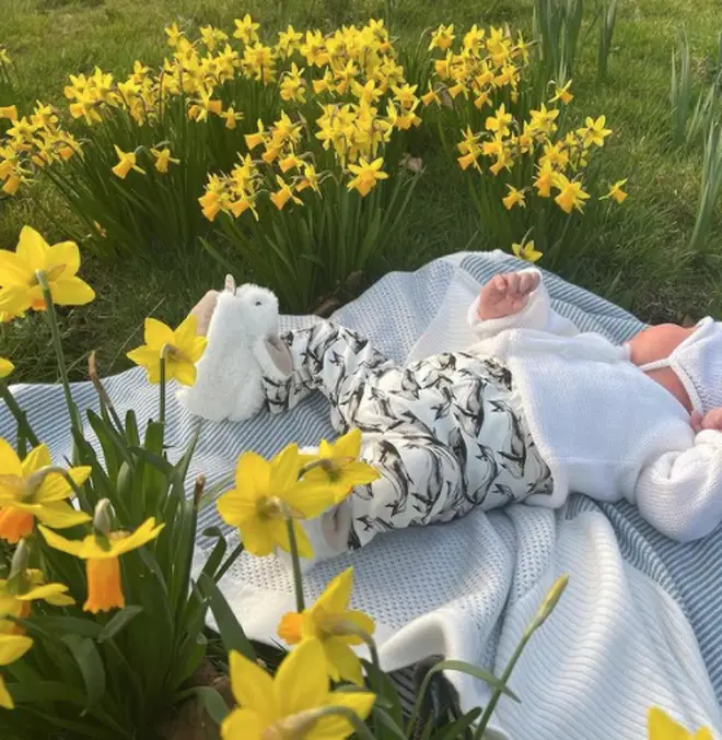 Baby August could be seen laying among the daffodils in the sweet Mother's Day post