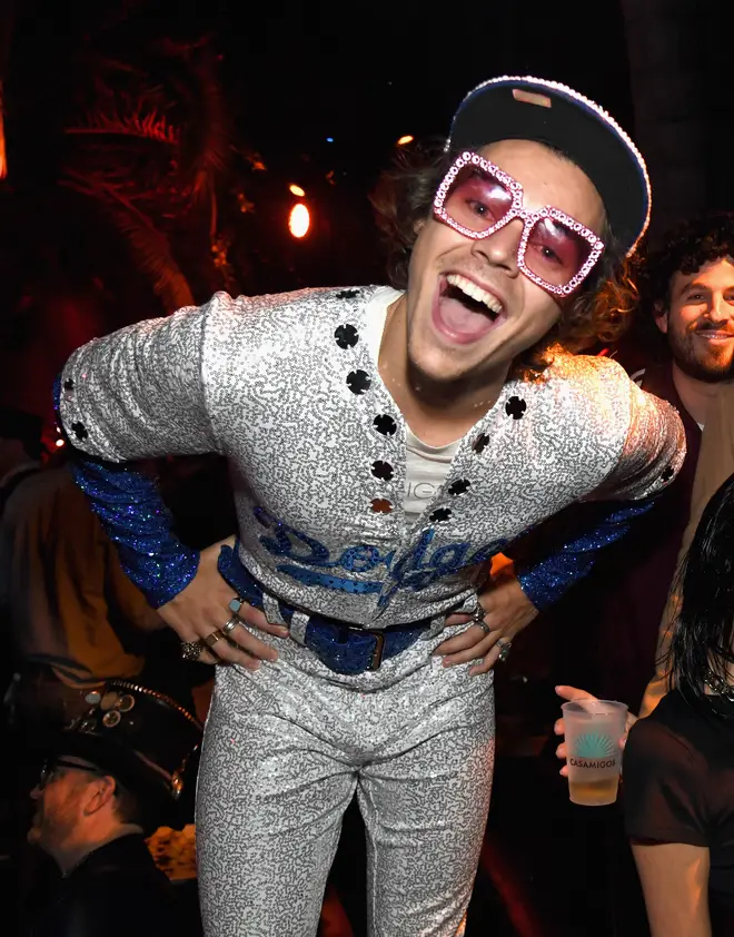 Harry Styles dresses as Elton John at the Casamigos Halloween Party