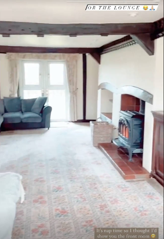 Stacey Solomon's lounge has wooden beams and a fireplace