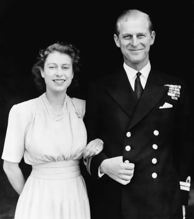 Prince Philip poses with Princess Elizabeth in July 1947. They were engaged at the time, and this photo was taken four months before their October wedding