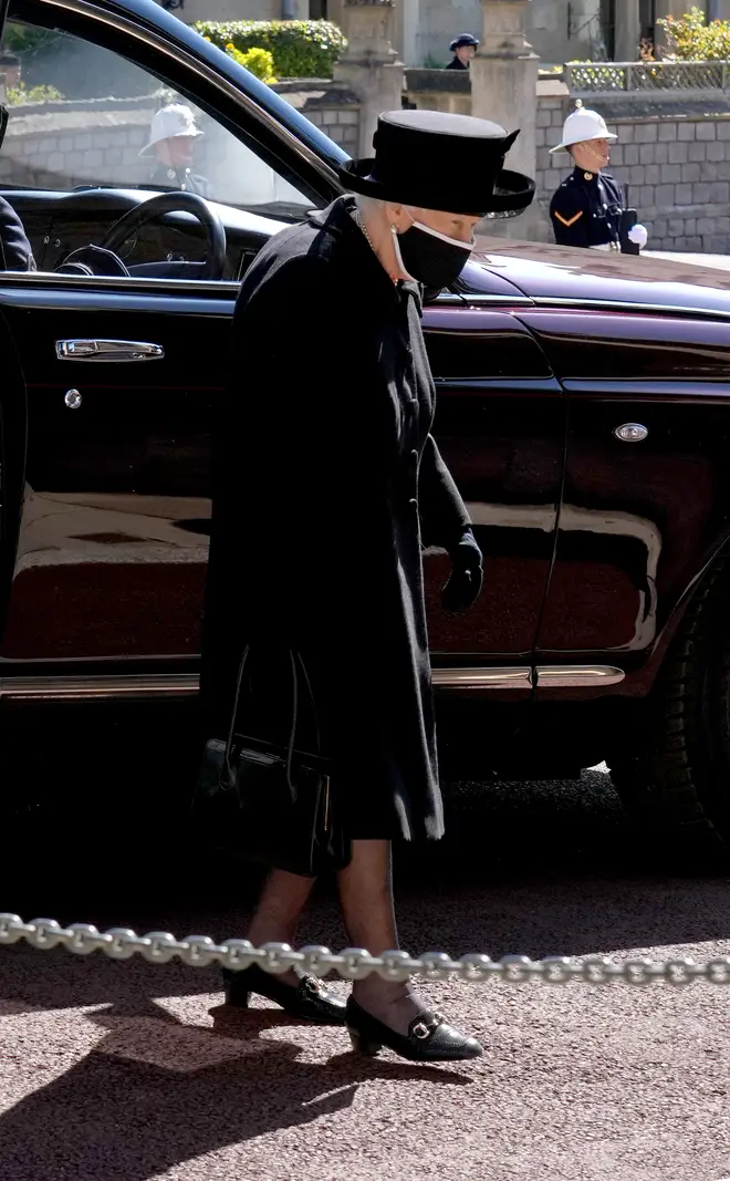 The Queen steps out of her state Bentley ahead of the funeral