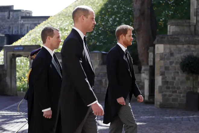 Peter Phillips walks between William and Harry in the procession