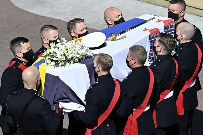 Pallbearers carry Prince Philip's coffin to St George's Chapel