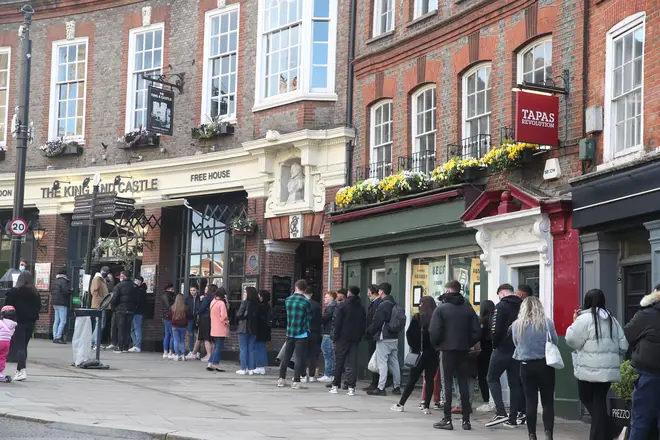 People queue outside a Wetherspoons branch in Windsor on April 16 after lockdown eased in England