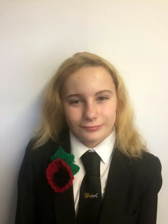 A student has been banned from wearing her oversized poppy
