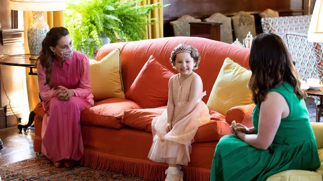 As promised, Kate Middleton wore a pink 'princess dress' to meet Mila this week