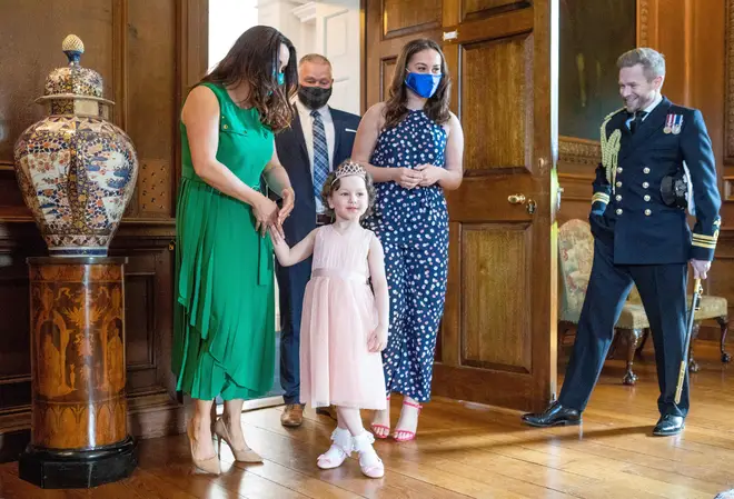 Mila and her family were invited to the Queen's Edinburgh home for the meeting