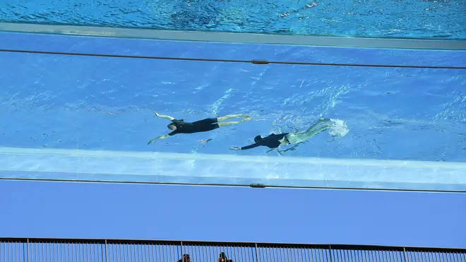 The pool has a glass bottom, which means swimmers can see the ground while taking a dip