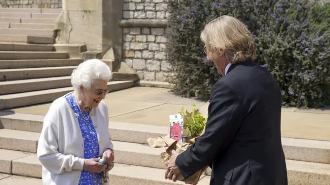 The Queen was handed a commemorative rose