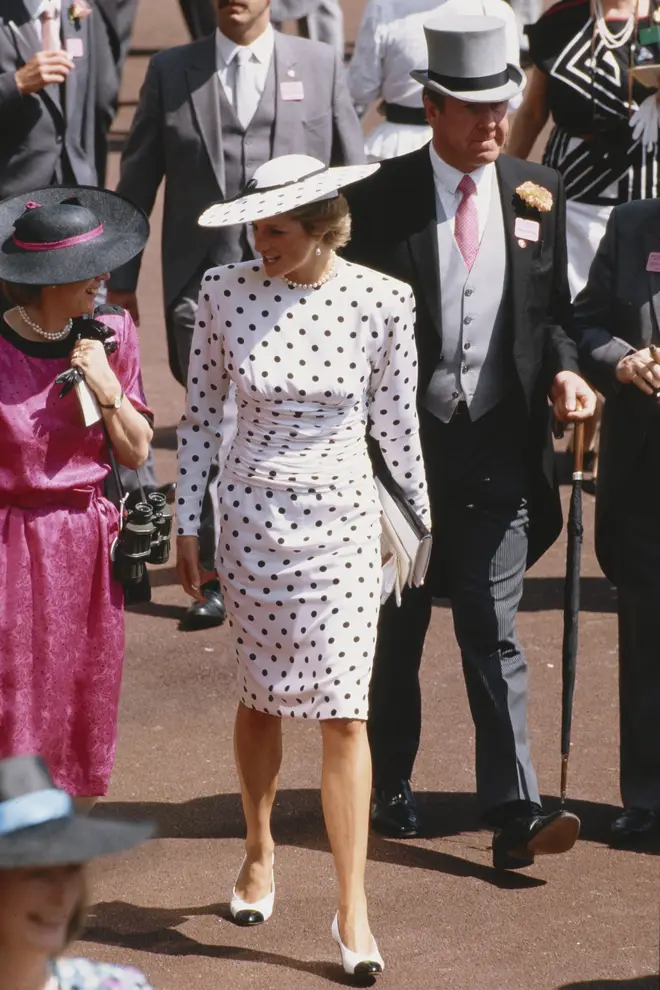 Princess Diana looked chic and classy in this navy and white polka dot dress, complete with matching hat