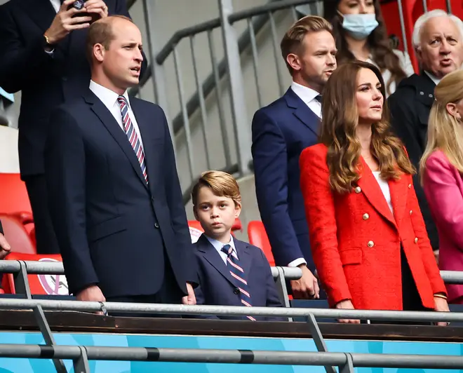 Prince George didn't look too interested in singing the National Anthem with his parents