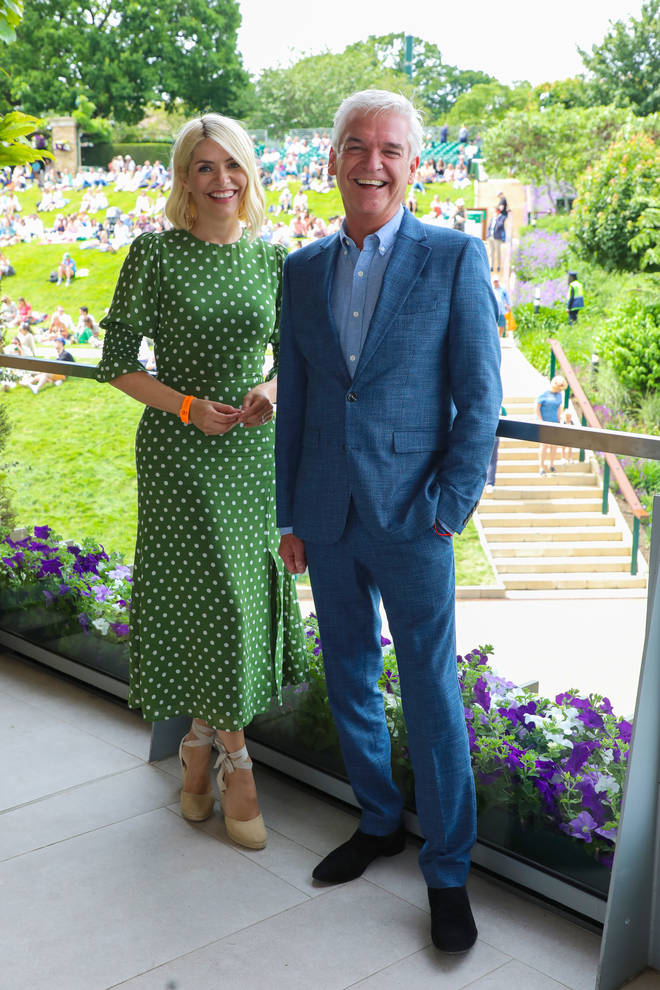 Holly looked stunning in a green polka dot dress, while Phil looked dashing in a blue linen suit