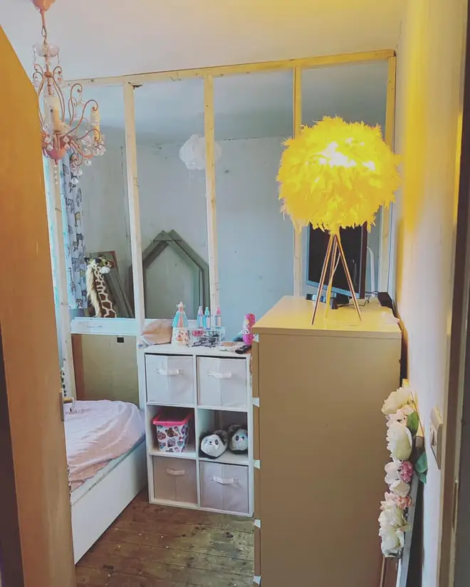 A stud wall split one room in to two for her baby son and her daughter