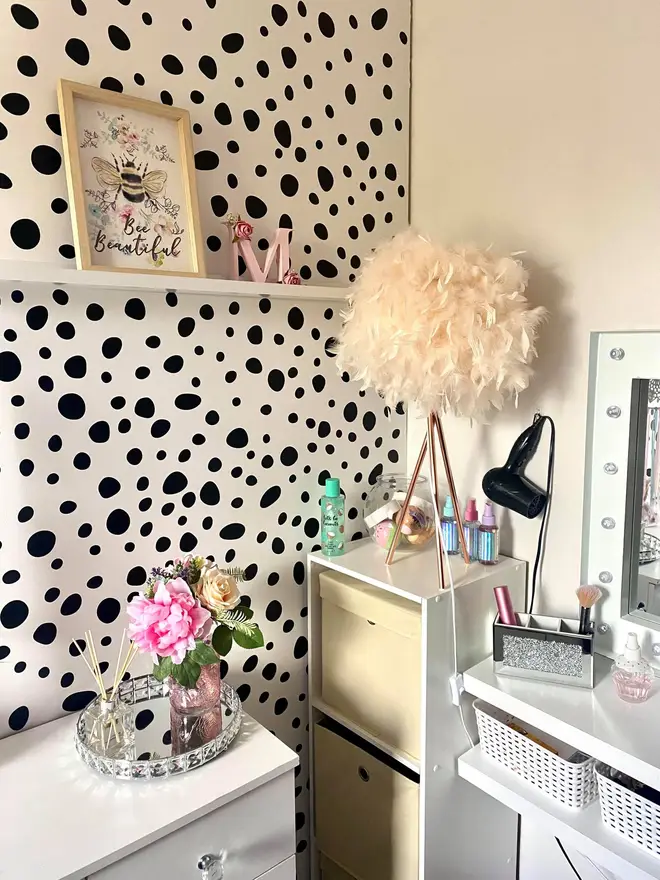 Her daughter's room is a girly haven with trendy polka dot walls