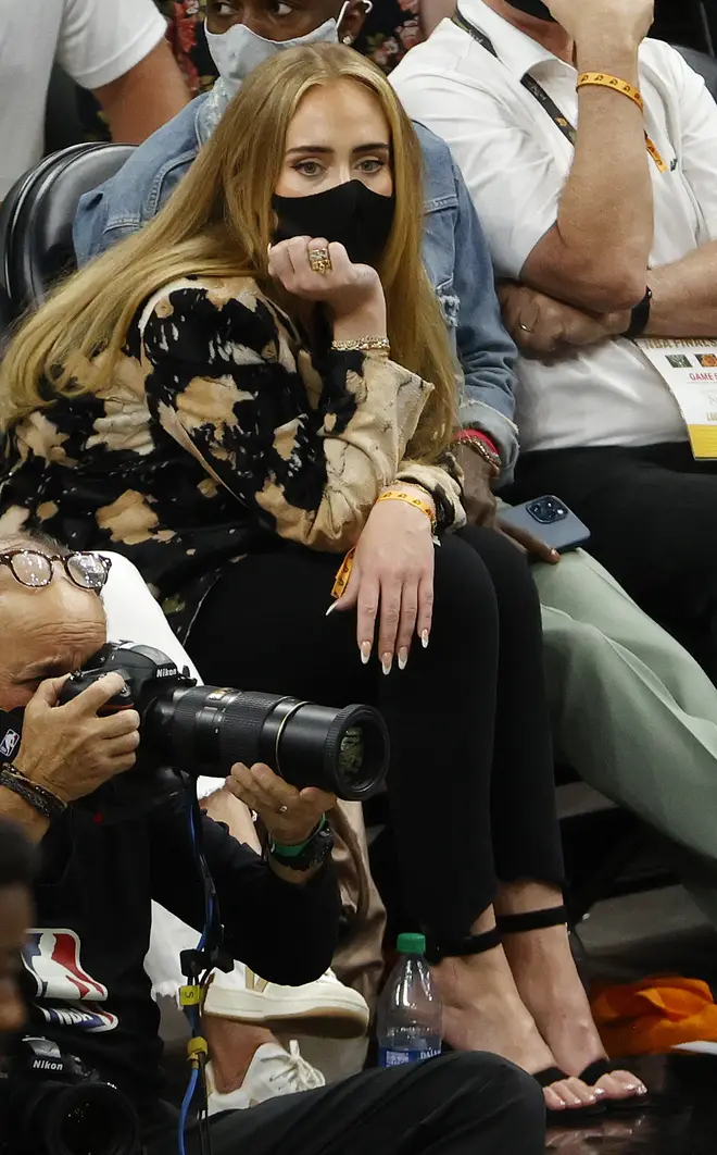 Adele showed off her new long locks as she sat in the crowd of the NBA Finals on Saturday night