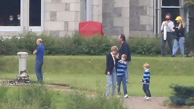 The two boys cast as William and Harry wore matching rugby shirts and jeans