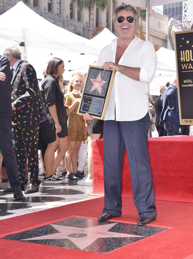 Simon Cowell receiving his star on the Hollywood walk of fame