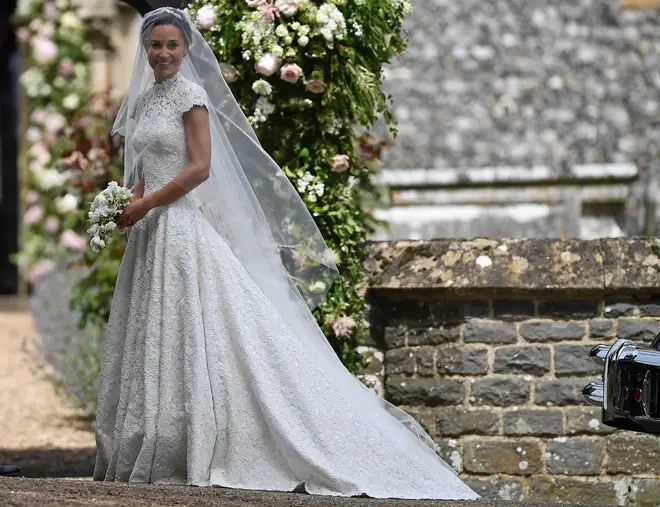 Pippa Middleton smiles to the cameras moments before her wedding to James Matthews
