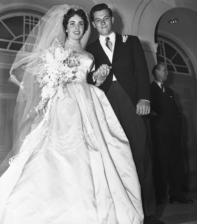 Elizabeth Taylor marries Conrad Hilton in a Helen Rose gown
