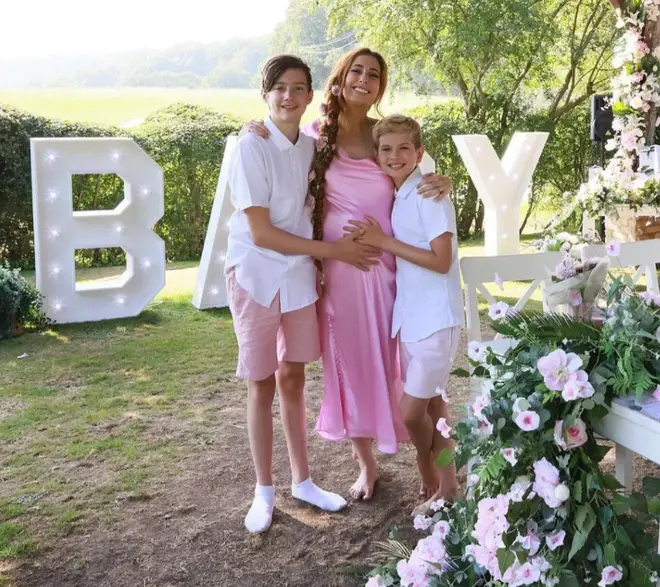 Stacey Solomon's sons, Leighton and Zachary, lovingly cradle their mum's baby bump