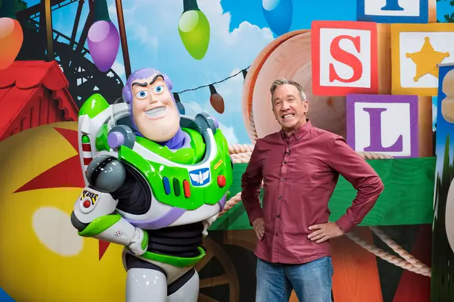 Tim Allen poses with his character, Buzz Lightyear
