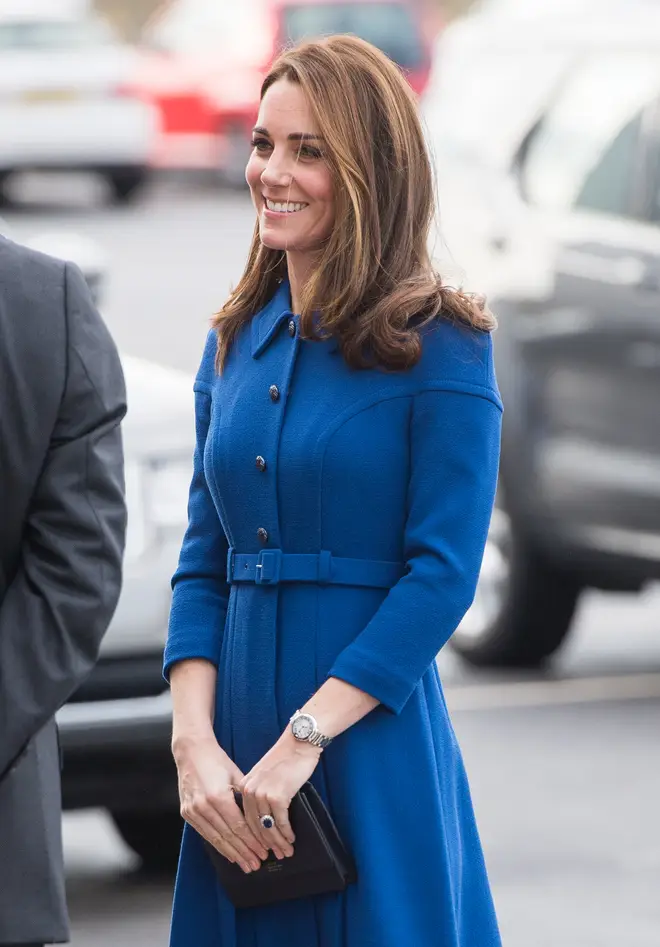 Kate keeps a compact mirror, along with three other items, in her handbag
