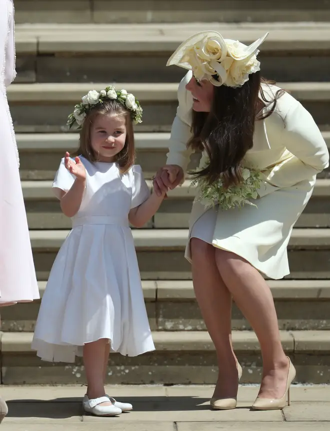 Kate encourages Princes Charlotte to wave during the Royal Wedding