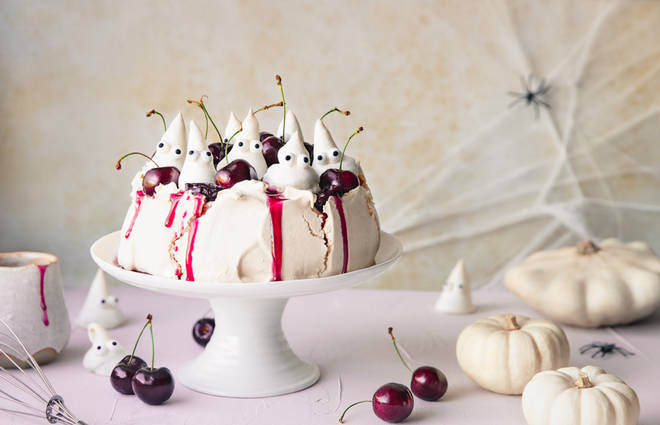 Pavlova with cherry syrup, fresh cherries and meringue ghosts (gluten-free)