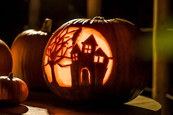 Have fun carving a haunted house into your pumpkin instead of a face