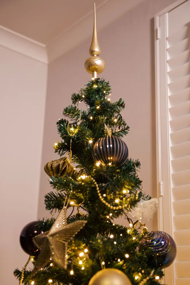 An ornate tree topper adds height and class and pulls the whole theme together
