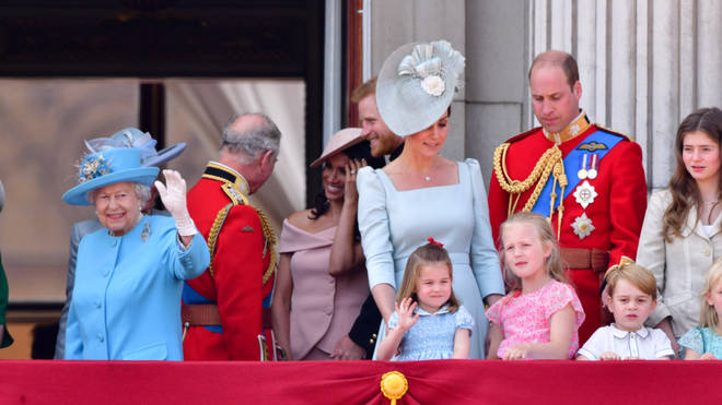 Princess Charlotte can be seen looking over at the Queen before deciding to copy her wave