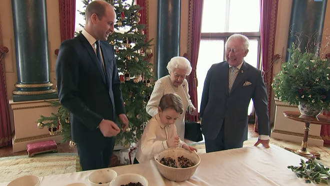 The Queen appeared to back away when Prince George was stirring the mixture