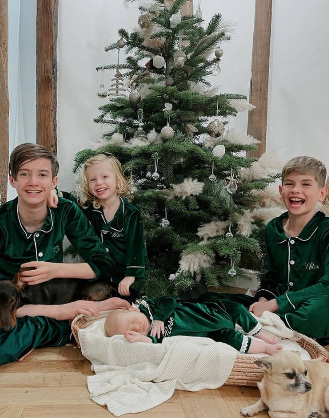 She shared some adorable photos of her kids by the tree