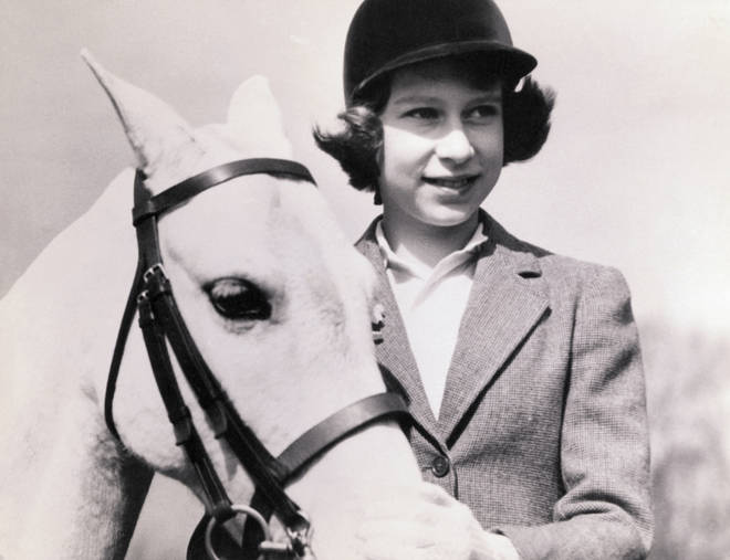 The Queen, a 10-year-old Princess at the time, with her horse
