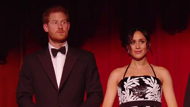 Meghan and Harry take their seats at the London Palladium