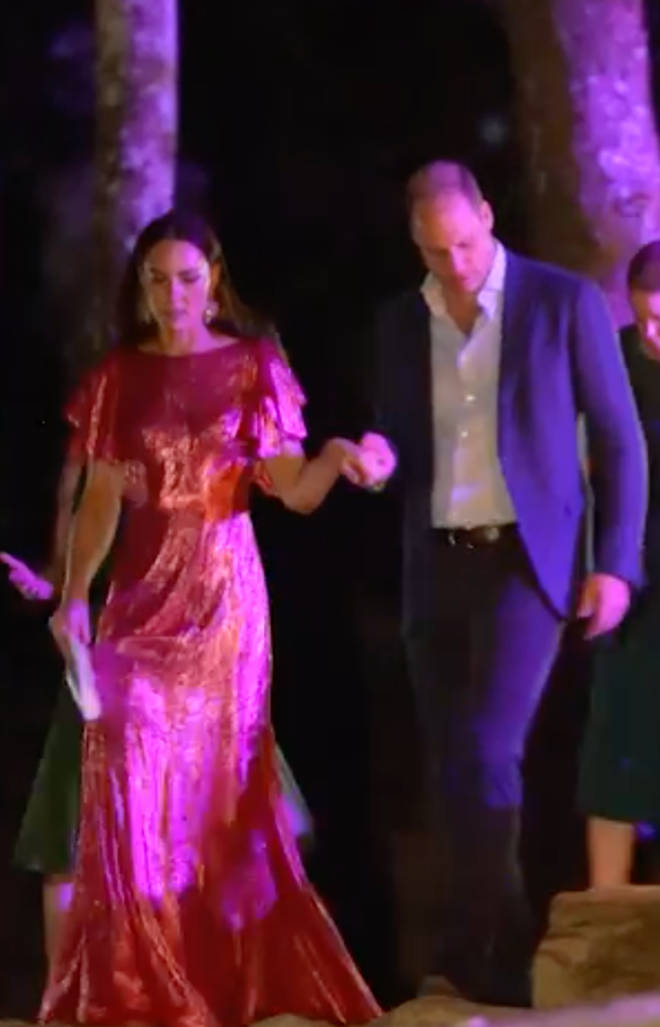 Prince William can be seen helping Kate Middleton down the stairs in the footage