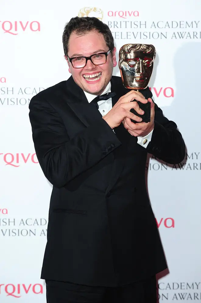 Alan Carr celebrating his BAFTA win