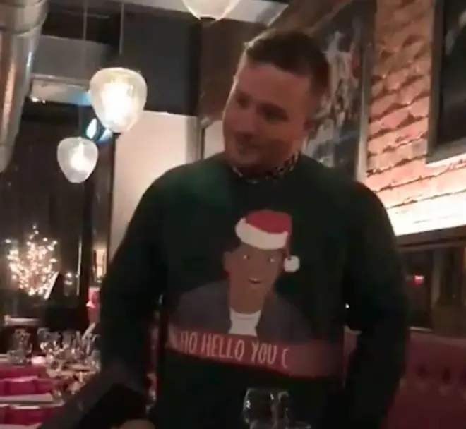 Footage posted on Facebook shows a man wearing the jumper at a Christmas party