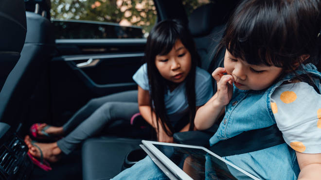 Do you let your kids play with iPads in the car? (stock image)