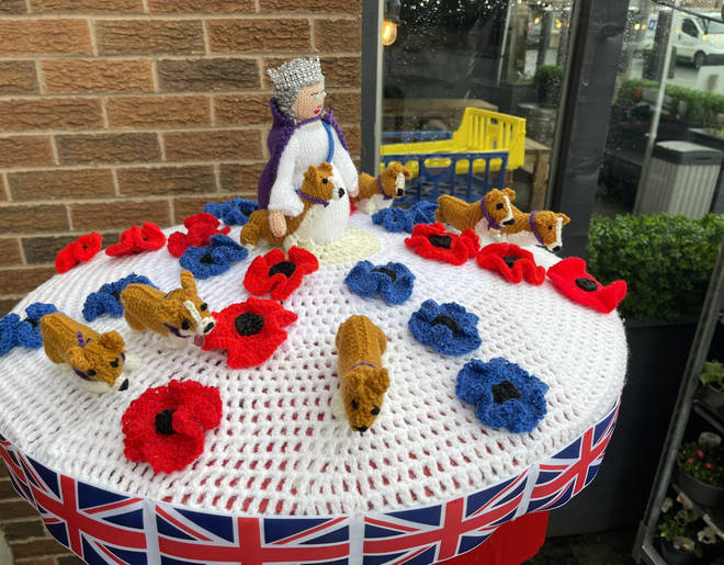 On this postbox topper, the Queen and her corgis take centre stage