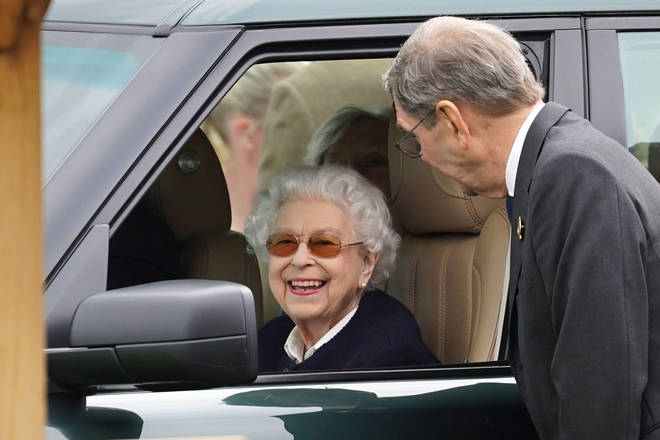 The Queen was seen beaming from her car