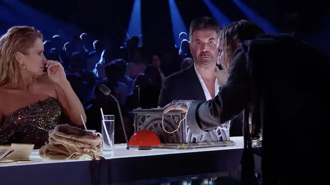 Simon Cowell looked scared of the character as he mad his way down to the judging panel
