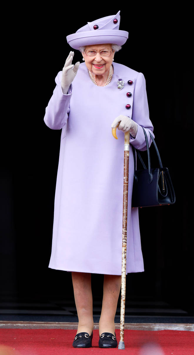 The Queen dressed in a gorgeous lilac ensemble for the event
