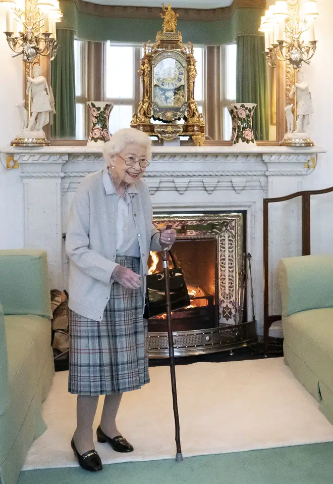 Her Majesty held Prince Philip's walking stick as she continues to struggle with mobility issues