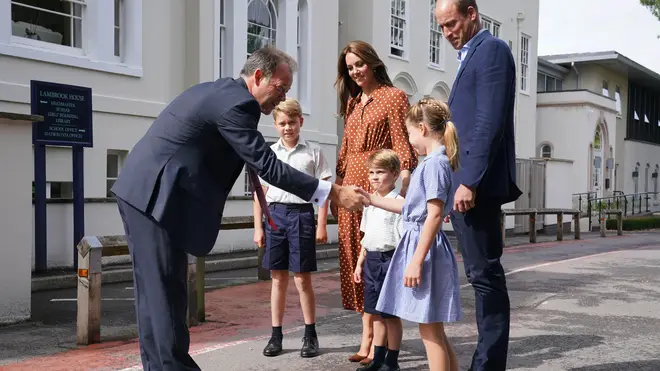The Cambridges met with Headmaster Jonathan Perry, who shook the children's hands